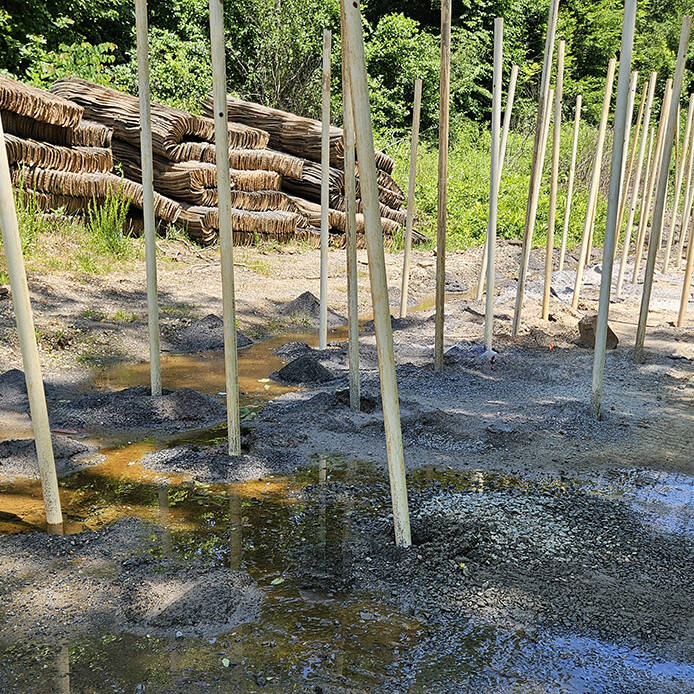 Holes are bored along Old Rio Mills Road in preperation for blasting